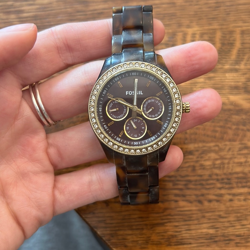 Tortoise fossil watch with diamond face. Minor stains on band. Needs new battery